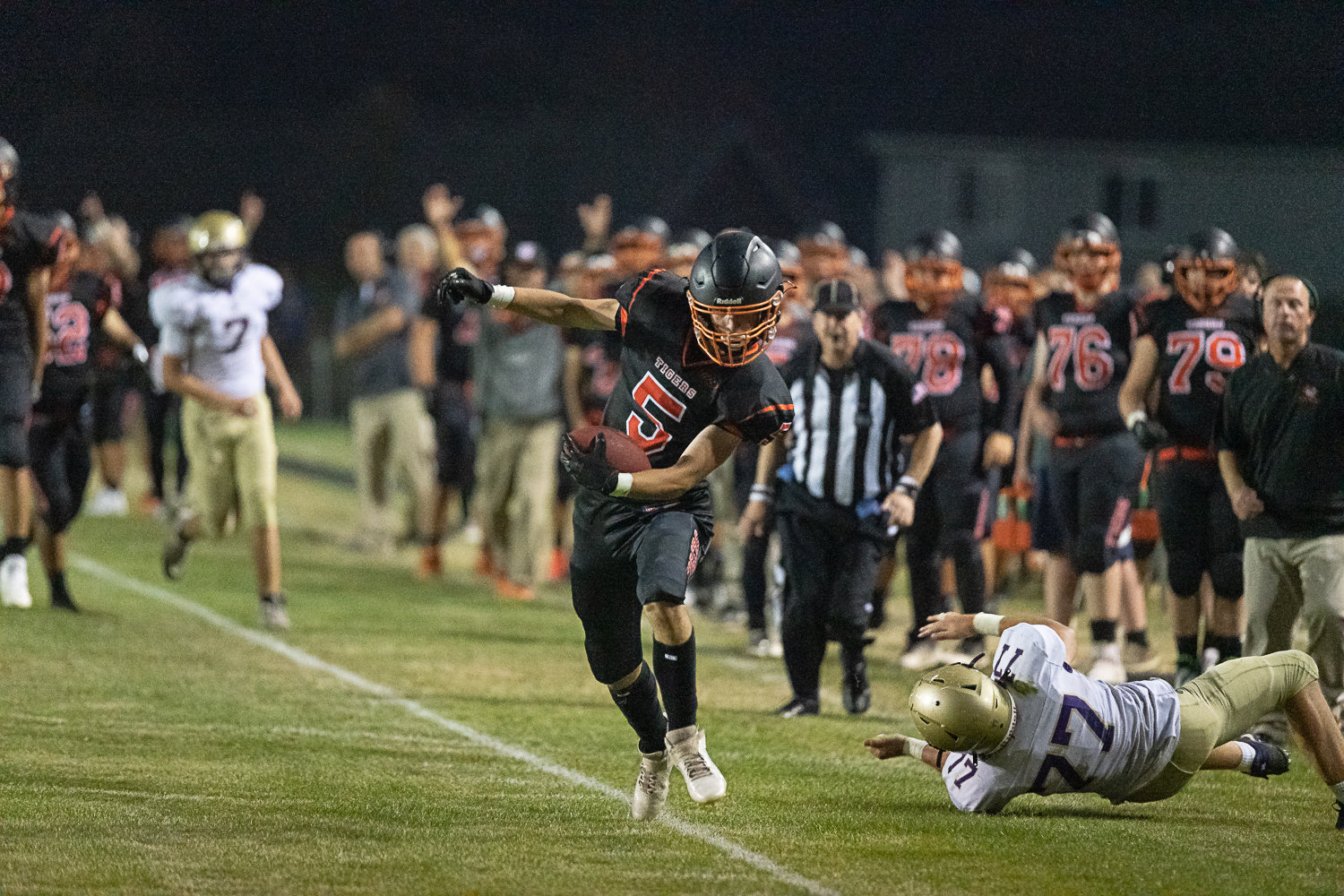 Napavine receiver Karsen Denault tiptoes along the sideline looking to stay in bounds after a catch Sept. 9 against Onalaska.