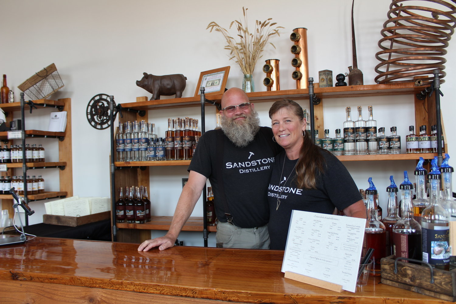 John and Jenni Bourdon, owners of Sandstone Distillery, are pictured in their new downtown tasting room.