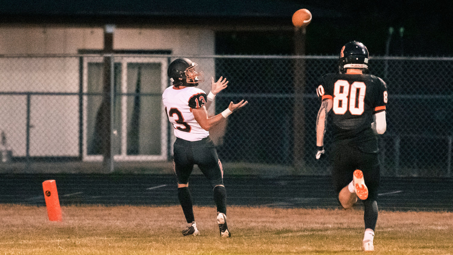 Napavine junior Conner Holmes (13) makes a long reception and scores Friday night in Rainier.