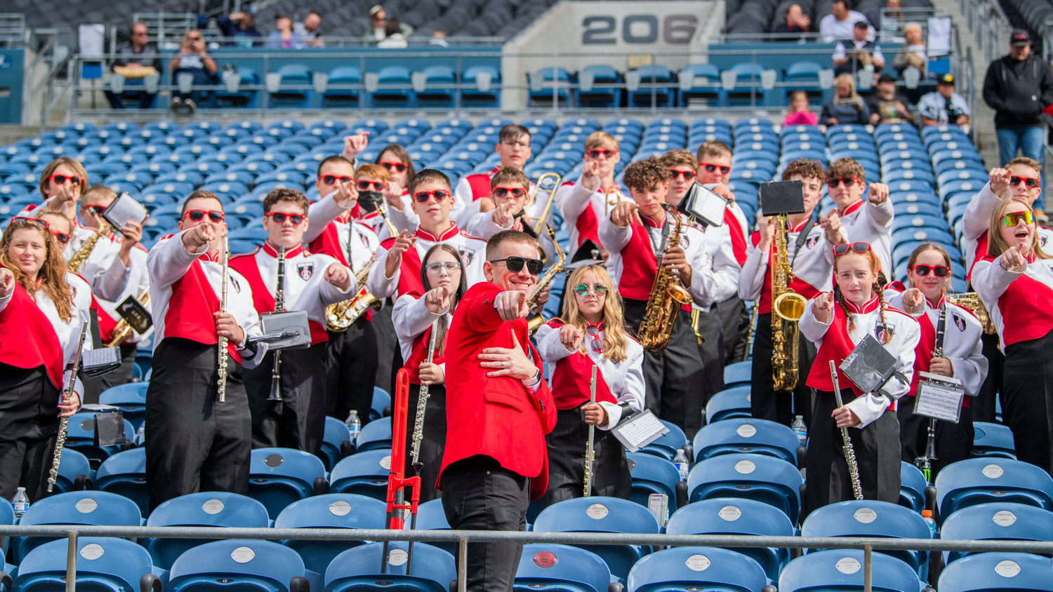The Tenino High School Band poses and points while performing at Lumen Field in Seattle on Saturday.