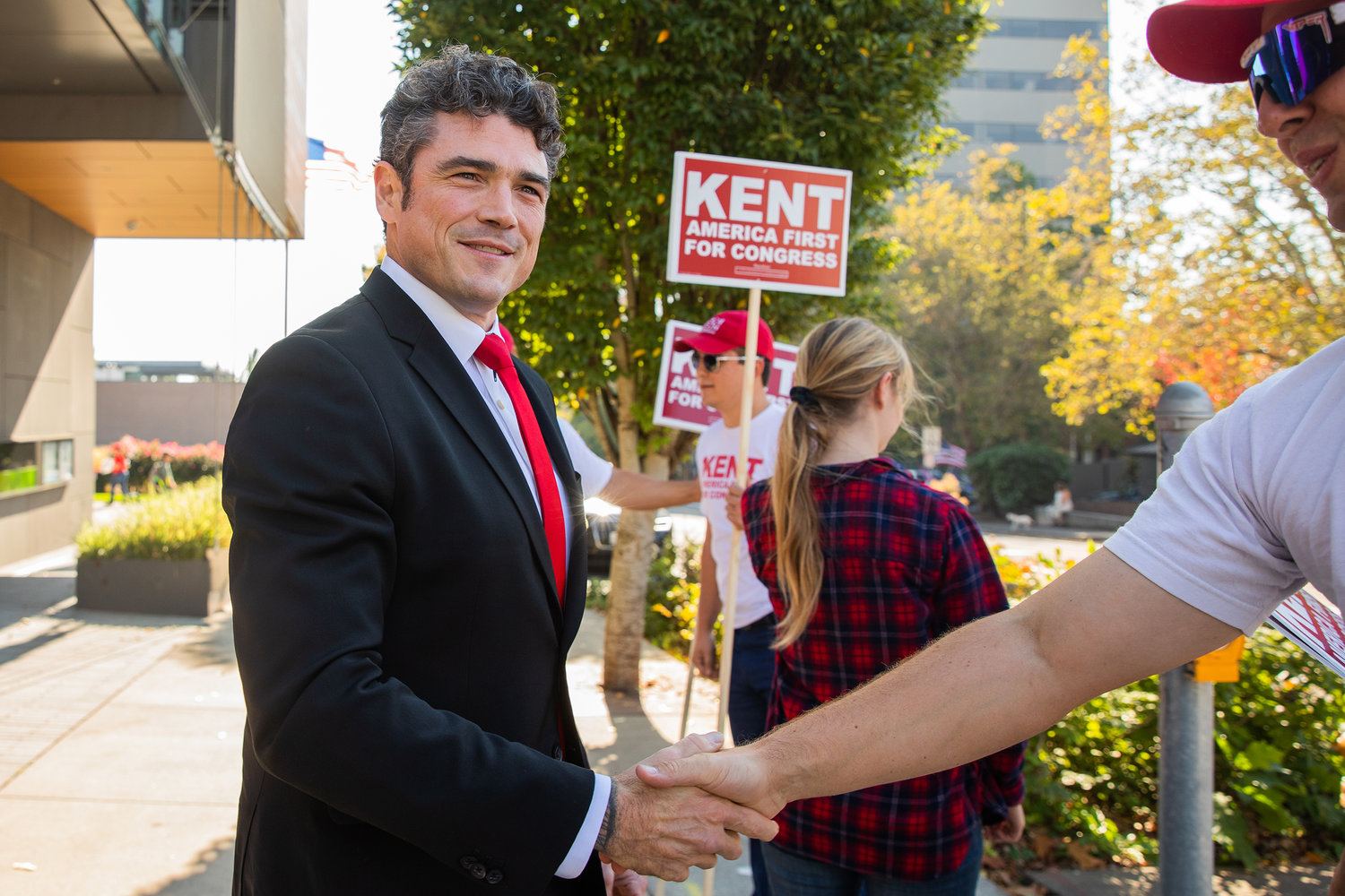 Joe Kent is greeted by supporters outside the Vancouver Community Library Saturday afternoon before the Congressional 3rd District Debate hosted by the League of Women Voters.