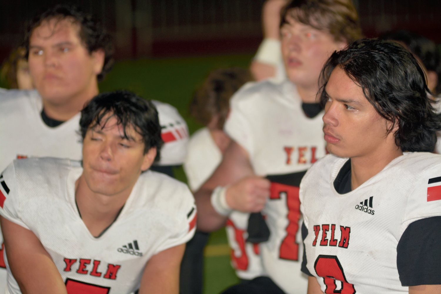 Twin brothers Marius and Damian Aalona listen to head coach Jason Ronquillo after the game on Oct. 27.