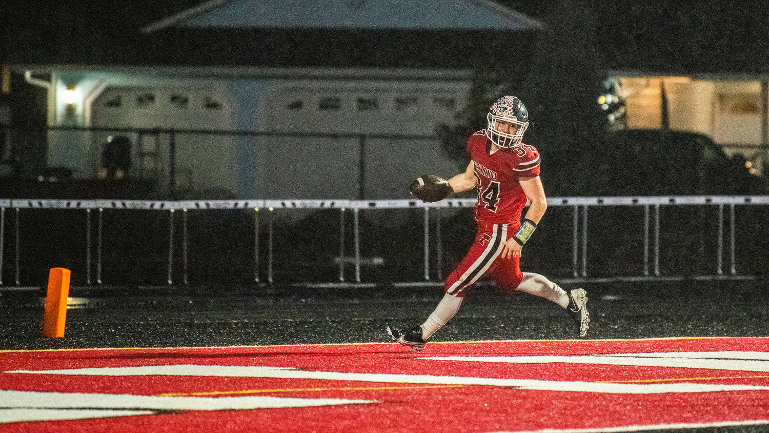 Tenino senior Randall Marti (34) runs the football into the end zone for a score during a Friday night game at Beaver Stadium.
