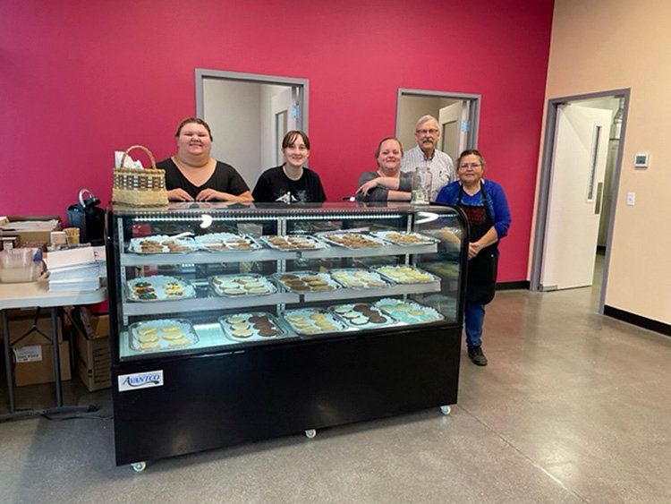 The staff of LUV Cookies poses for a photo in celebration of opening its new Tumwater location.