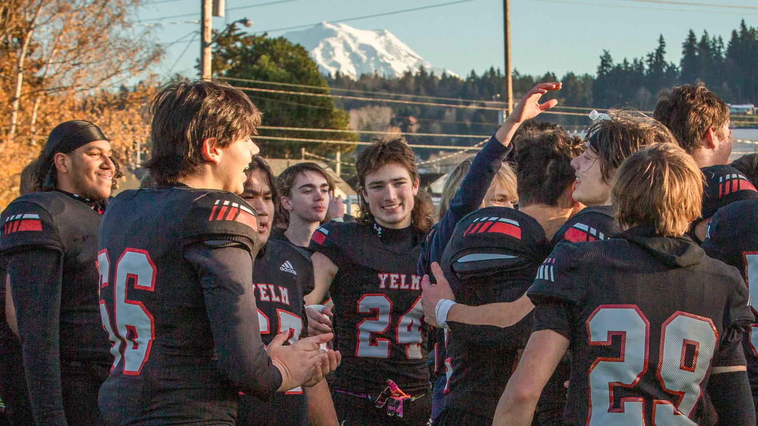 Mount Rainier sets the backdrop for an elated Yelm football team after they won the 3A state championship in Puyallup on Dec. 3.