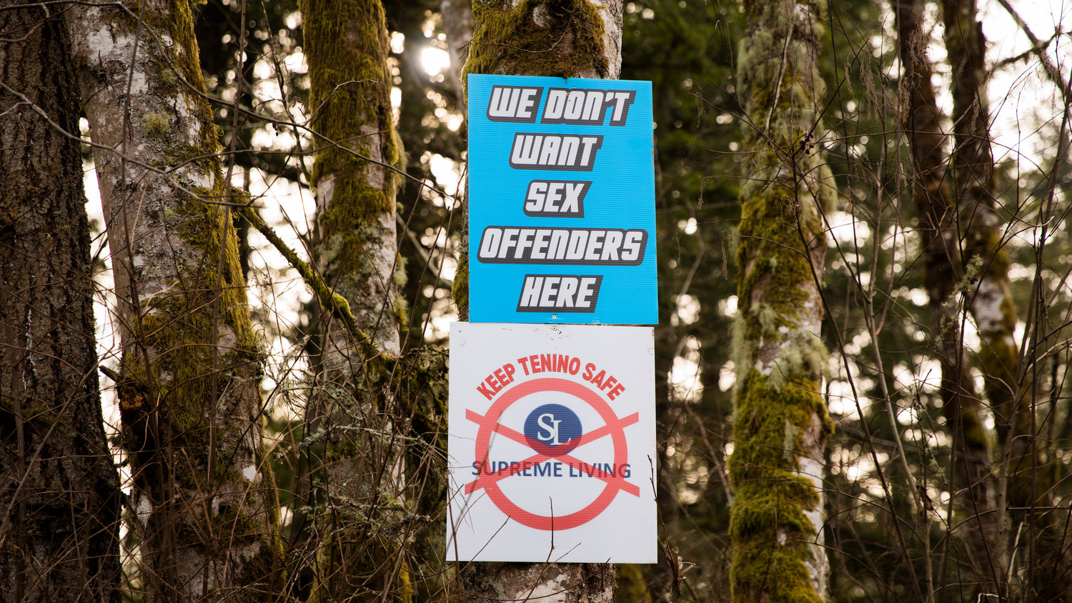 Signs are hung on trees surrounding the Supreme Living facility located at 2813 140th Ave. SW in Tenino on Wednesday.