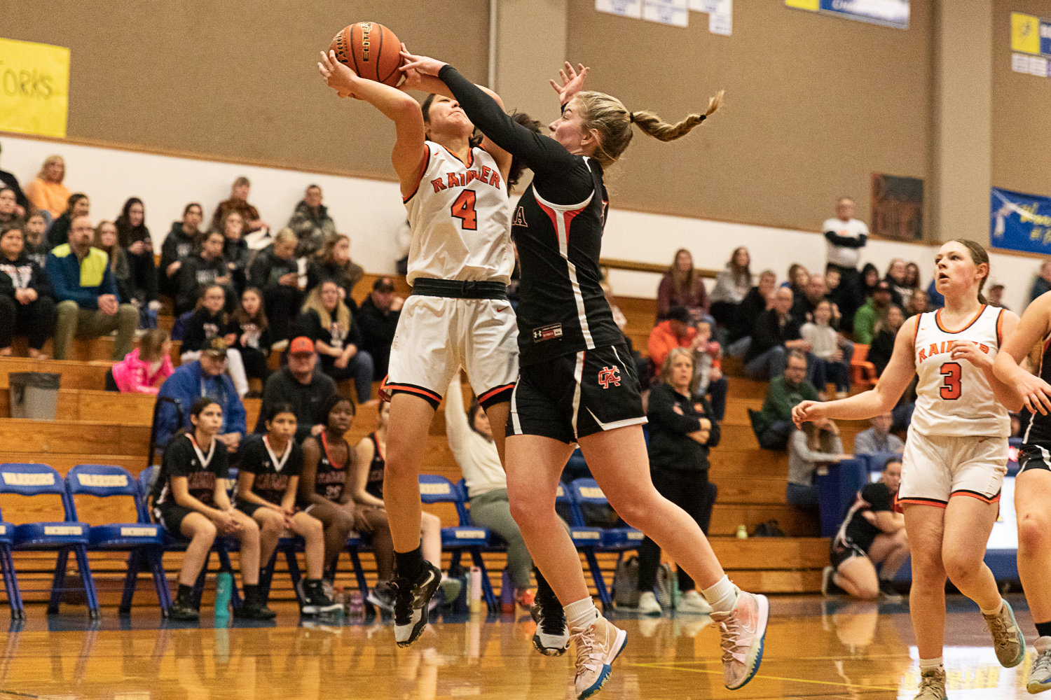 Rainier guard Angelica Askey is blocked by Kalama's Reese Johnston in the first round of the 2B District tournament Feb. 4 at Rochester.