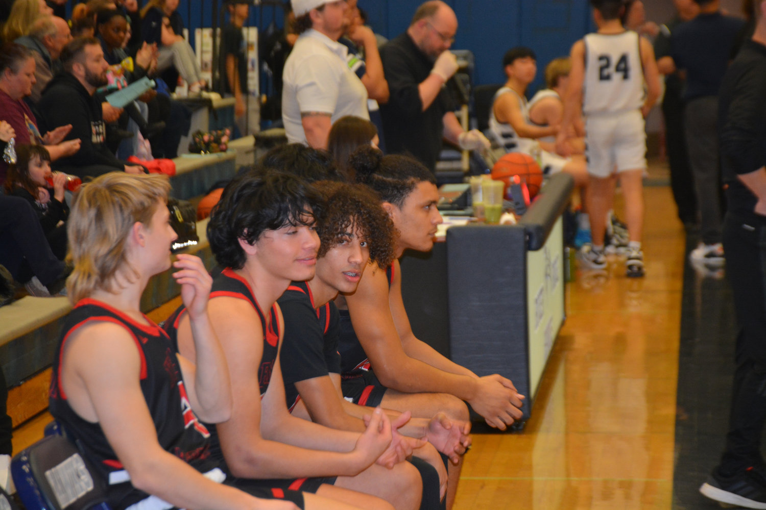 The Tornado starters sit on the bench prior to the start of their matchup against River Ridge on Feb. 2.