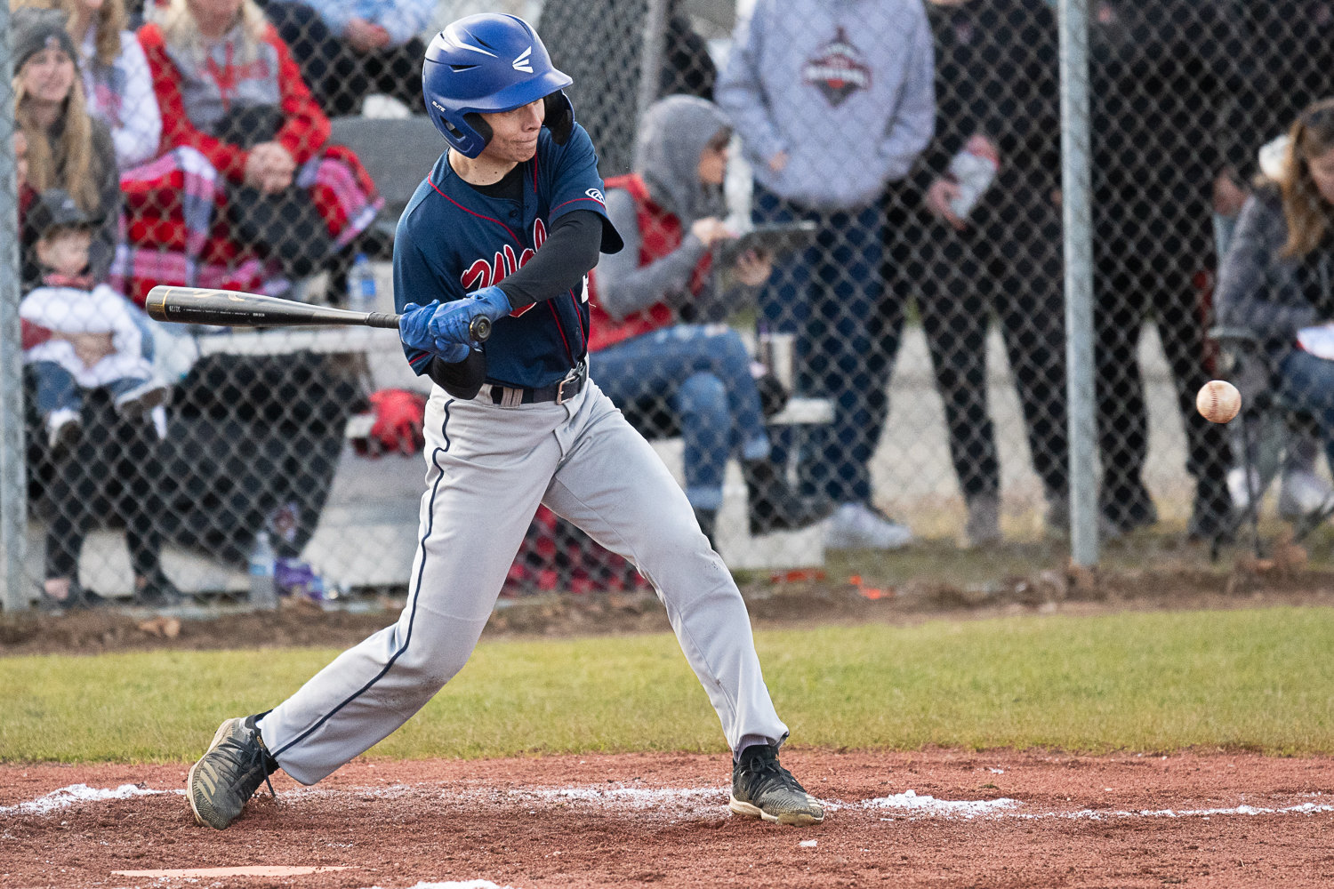 Back Hills' Truman Wimsett chops an infield single during the top of the second inning of the Wolves' 7-4 loss at Tenino on March 14.