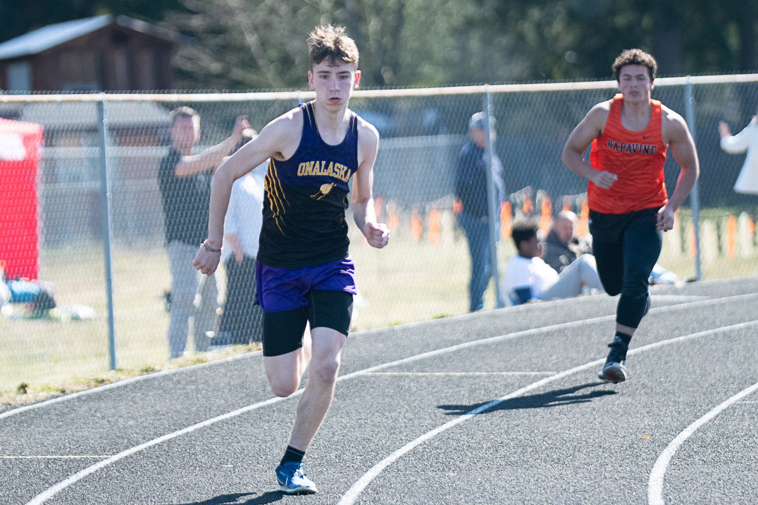 Onalaska's Cole Russon gets going in the boys 400 meters, with Napavine's Riley Griffith behind him, at the Rainier Icebreaker on March 18.