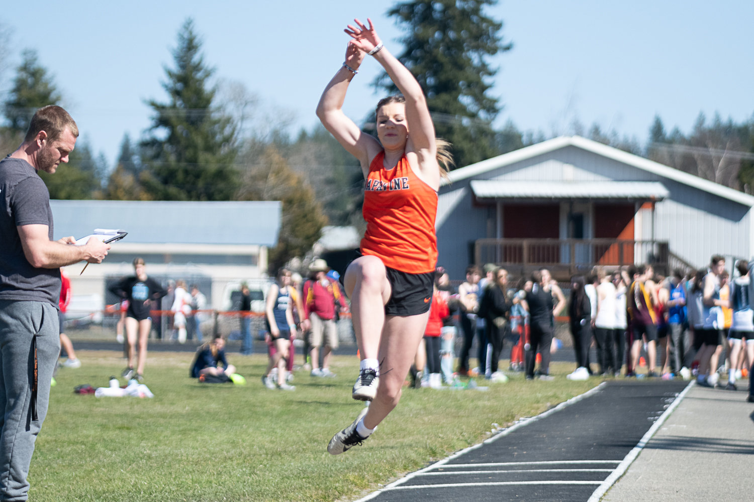 Napavine's Maddie Dickinson takes on the long jump at the Rainier Icebreaker on March 18.