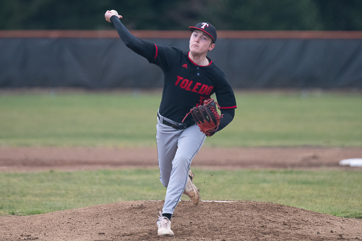 Caiden Schultz throws a pitch during Toledo's March 20 game at Napavine.