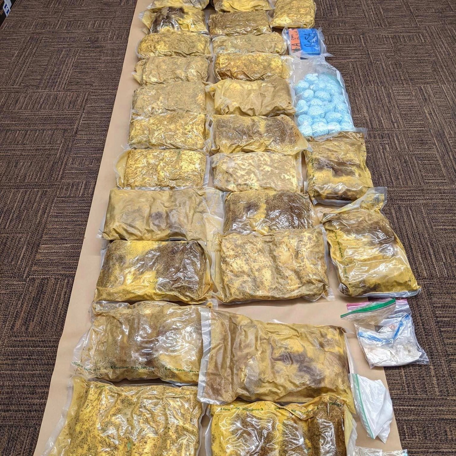 A coordinated arrest and search operation last Wednesday — involving 10 SWAT teams and more than 350 officers — yielded 177 guns, several kilograms of drugs and more than $330,000 in cash from 18 locations in Washington and Arizona.