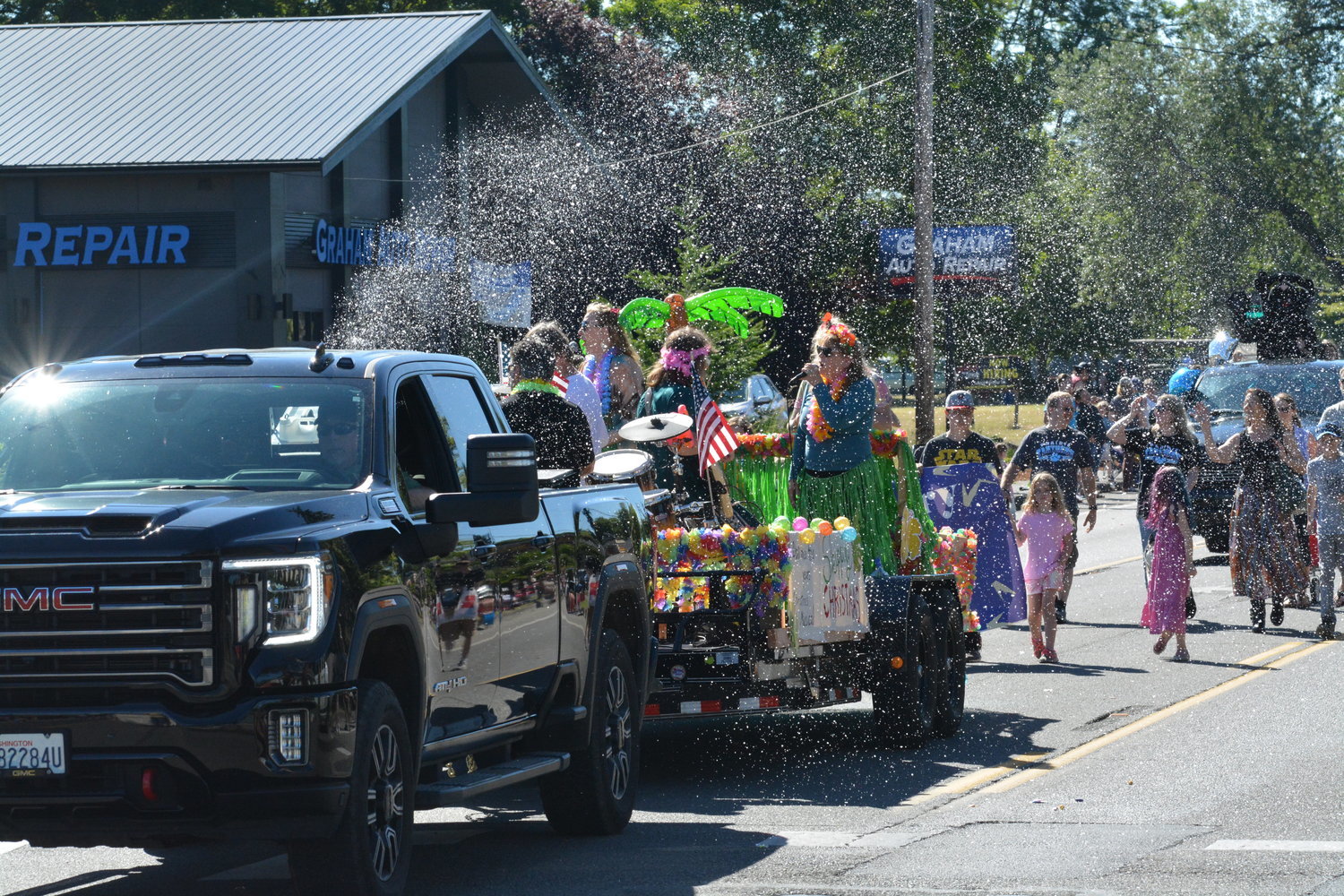 A parade float promoting a Christmas play makes its way down Yelm Avenue during the annual Prairie Days Parade on June 25, 2022.