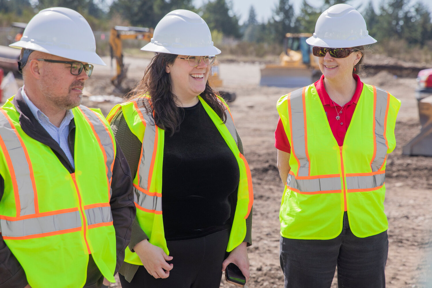 Sarah Kohout, district director for U.S. Rep. Marie Gluesenkamp Perez, D-Washougal, smiles during a tour at the construction site of an agricultural park along Old Highway 99 SE in Tenino on Thursday, April 27, 2023.