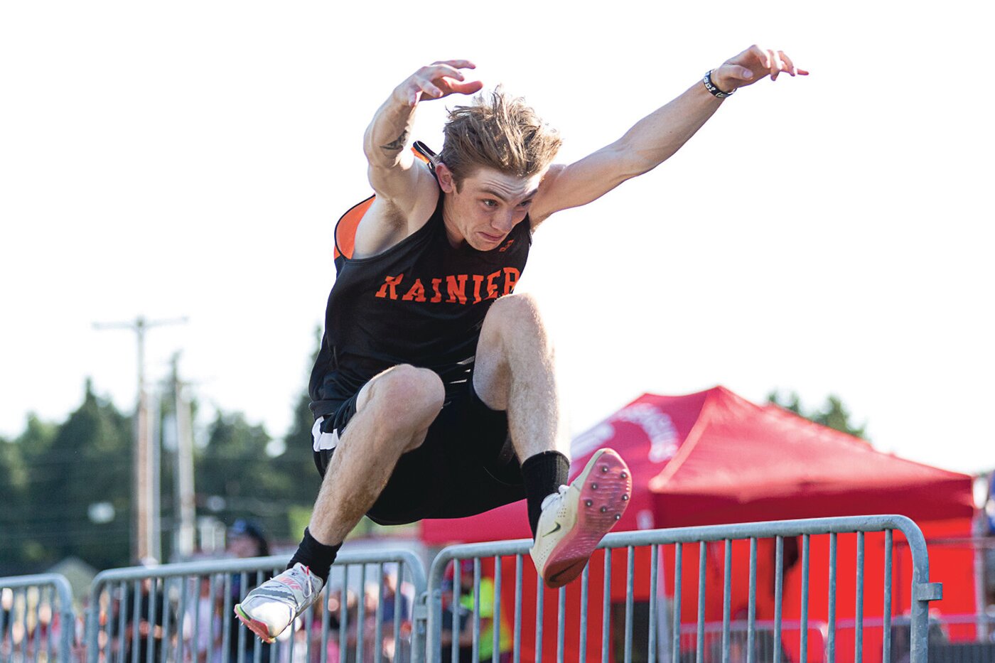 Rainier's Chase MacFarland leaps through the air in the long jump May 19 at W.F. West in the 2B District 4 Championships.