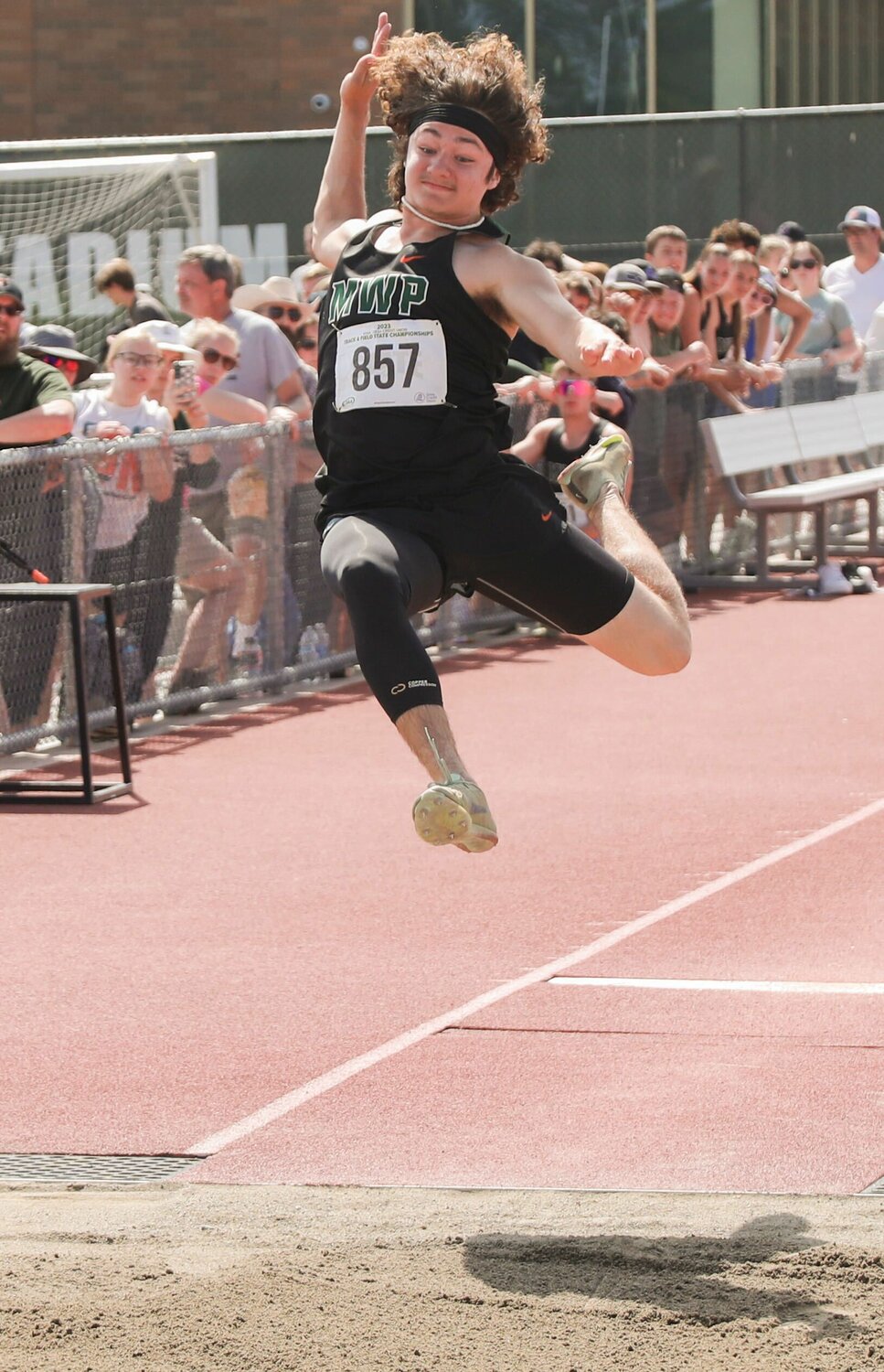 Max Lowe goes airborne in the long jump at the 2B state track and field championships, May 26 in Yakima.