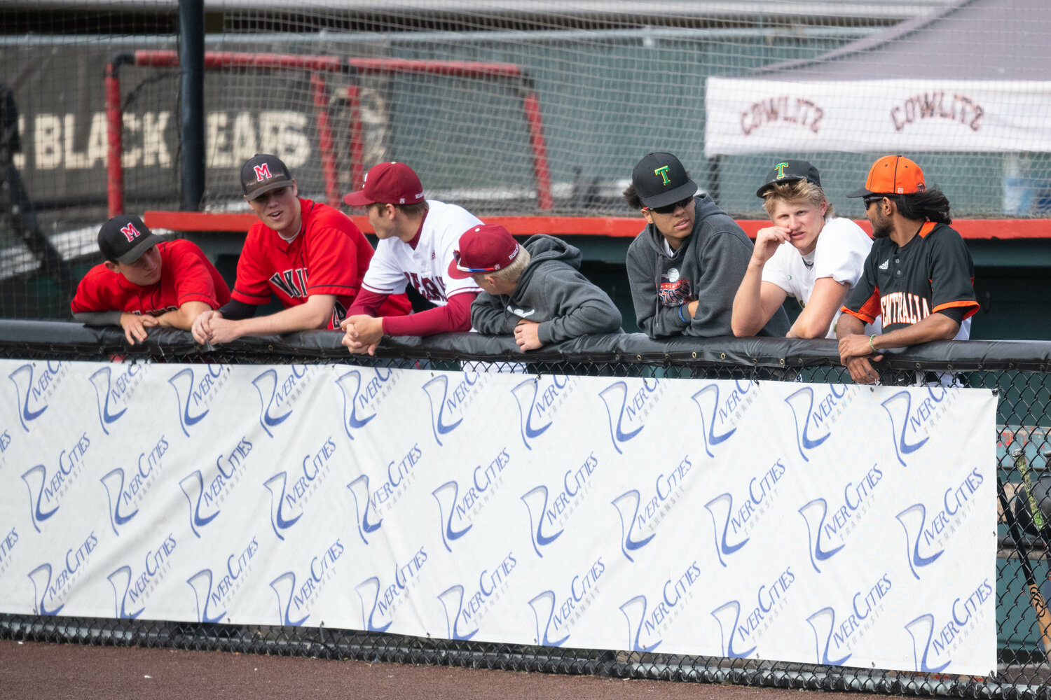 Players from Mossyrock, W.F. West, Tumwater, and Centralia chat in the dugout during the 45th annual Southwest Washington Senior All-Star Game, May 31 at Story Field in Longview.