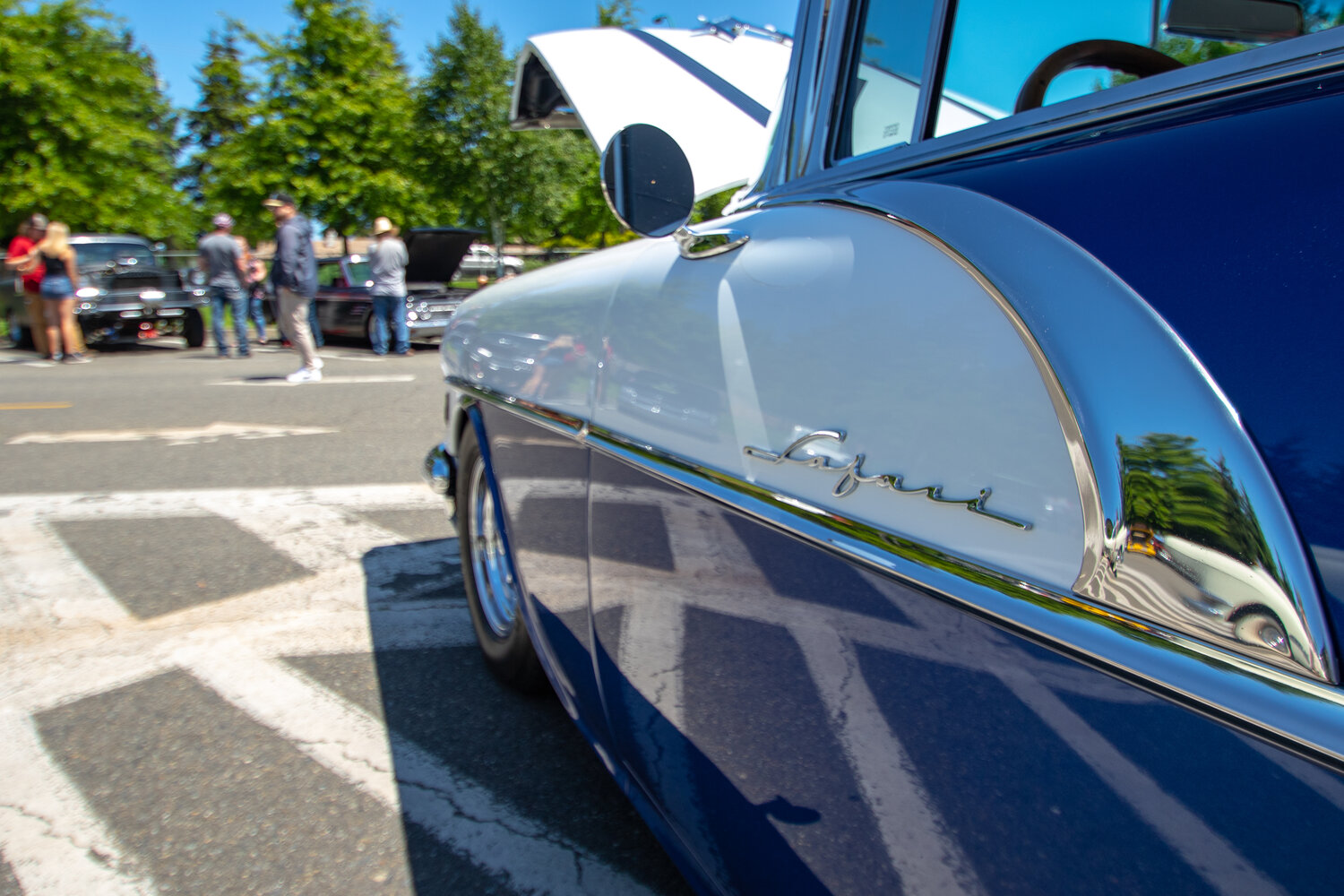 The badge and chrome lining can be seen on the side of Thomas Kelly's 1956 Pontiac Safari wagon at the Yelm High School car show on Sunday, June 4.