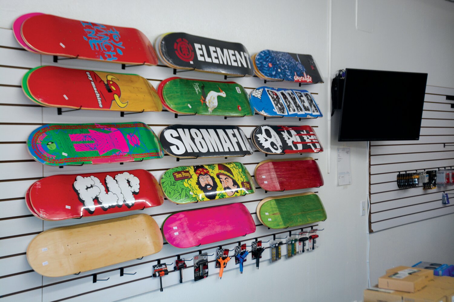 Skateboards hang from the walls of Rides Bike and Board Shop in Yelm on July 14.
