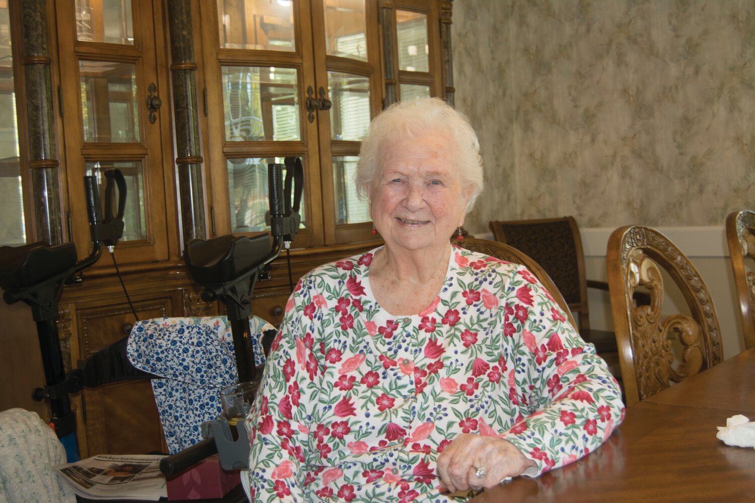 Anna Newman poses at the dining hall at Prestige Senior Living Rosemont in Yelm.