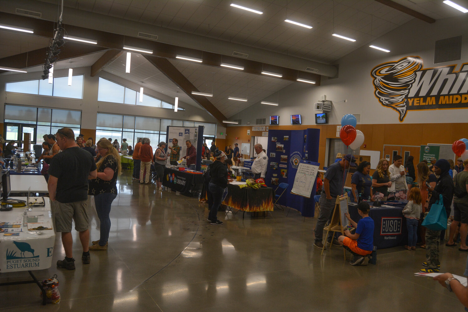 More than 20 community sponsors set up tables at STEMKAMP Family Day in the Yelm Middle School cafeteria on Aug. 11.