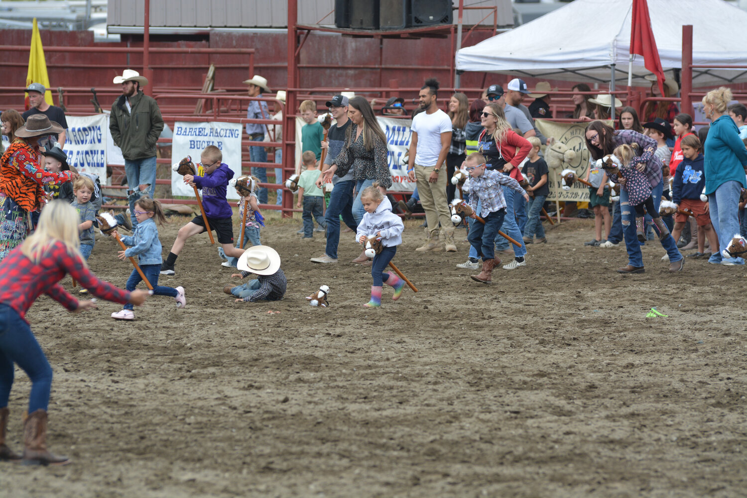 Rodeo youngsters compete in the annual “Sunday stick-horse race” at the Roy Rodeo on Sept. 3.