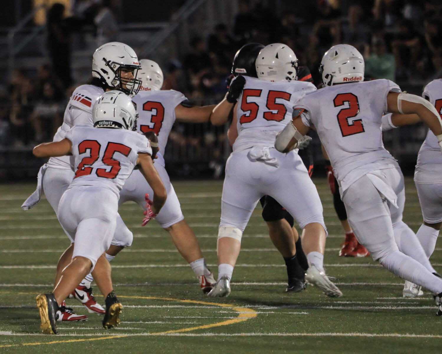 Senior running back Anthony Kiamco takes a handoff against the Camas Papermakers on Sept. 1.