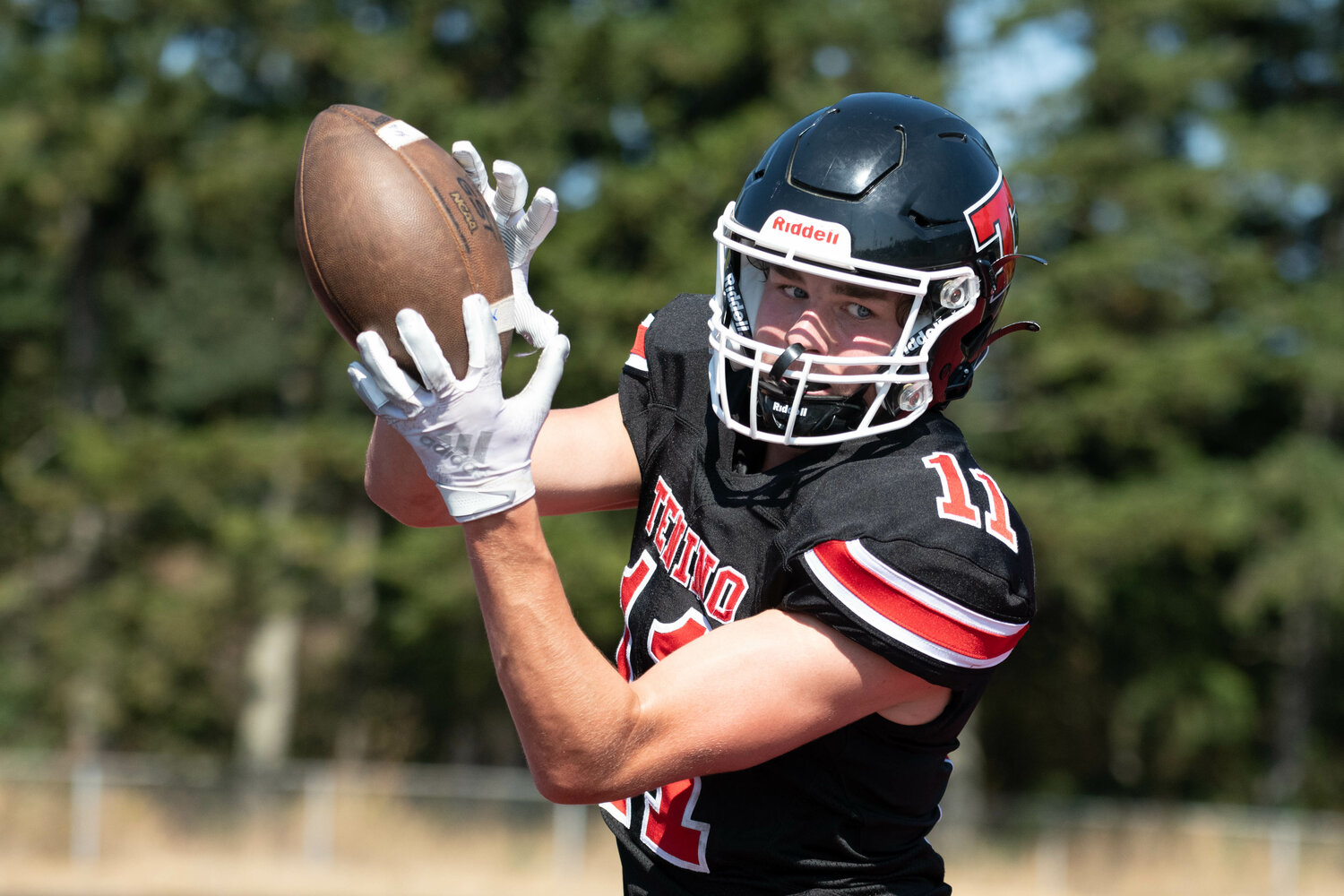 Jack Burkhardt comes down with a touchdown reception in the first half of Tenino's 34-32 loss to Zillah on Sept. 9.