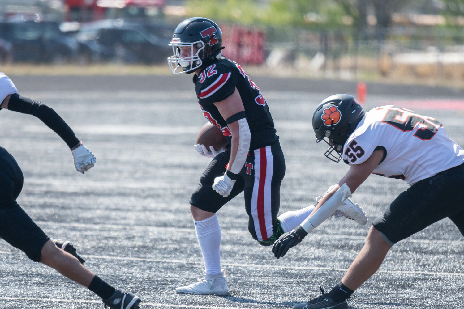 Mikey Vassar takes a handoff in the first quarter of Tenino's 34-32 loss to Zillah on Sept. 9.