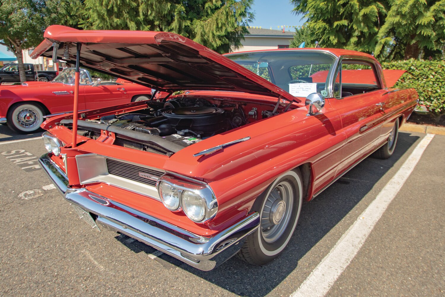 A 1962 Pontiac Grand Prix is displayed outside of Yelm High School for the Yelm FFA Alumni Association car show on Saturday, Sept. 9.