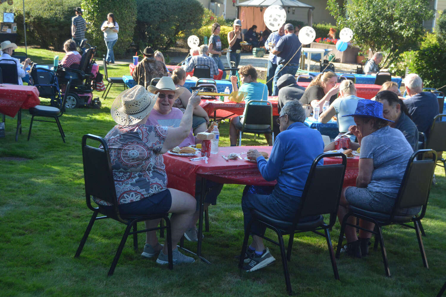 Residents dine on pulled pork sandwiches and baked beans during the Rosemont Round-Up on Sept. 8.