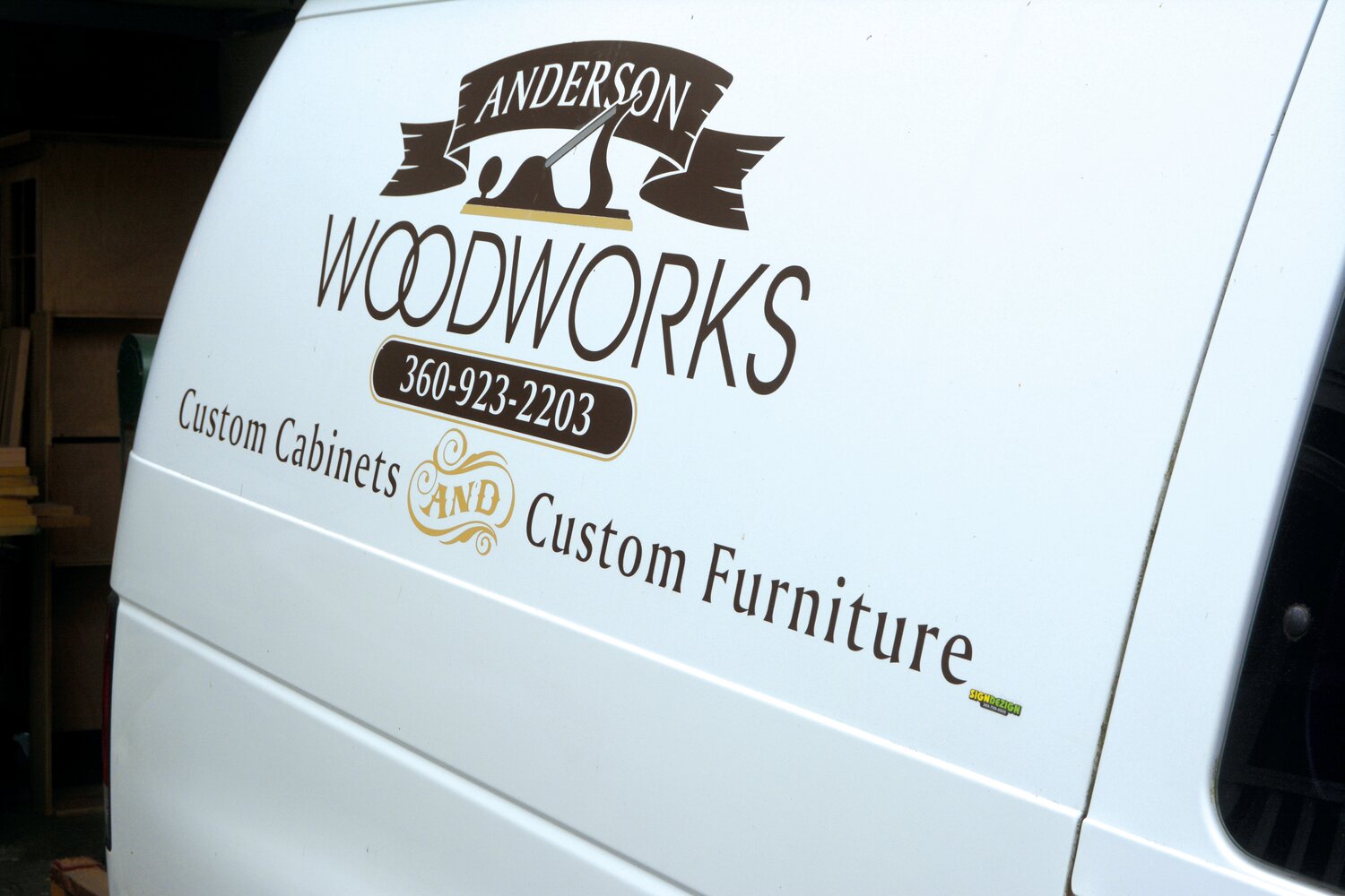 Brian Anderson's logo for Anderson Woodworks on his van in his driveway on Oct. 20.