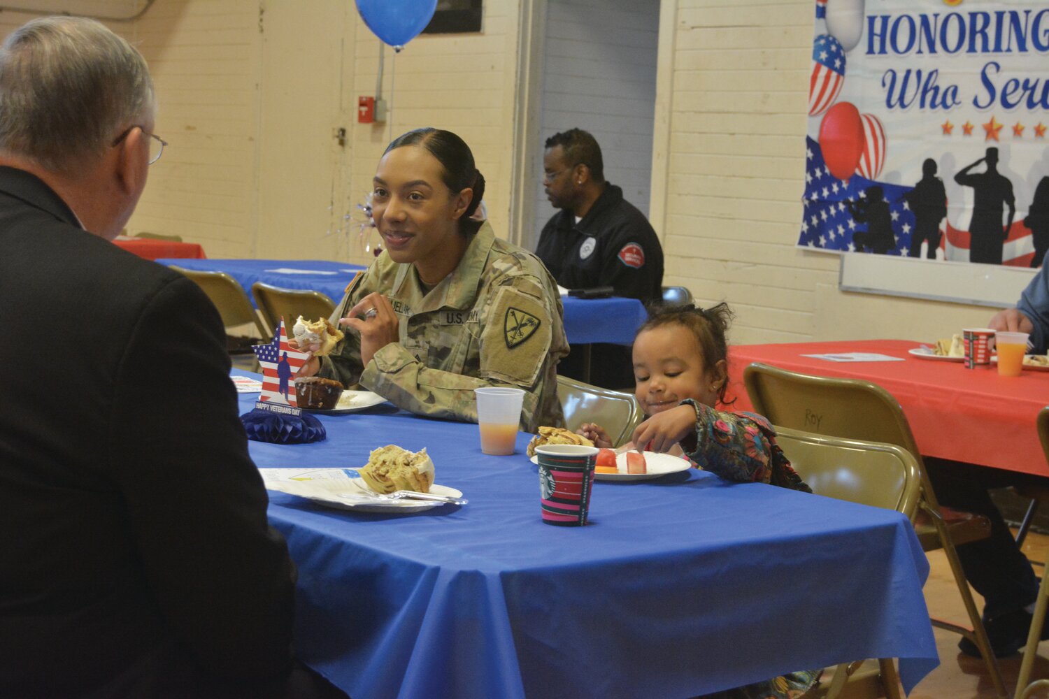 A member of the United States Army and her family enjoy breakfast at Roy Elementary School on Nov. 9.