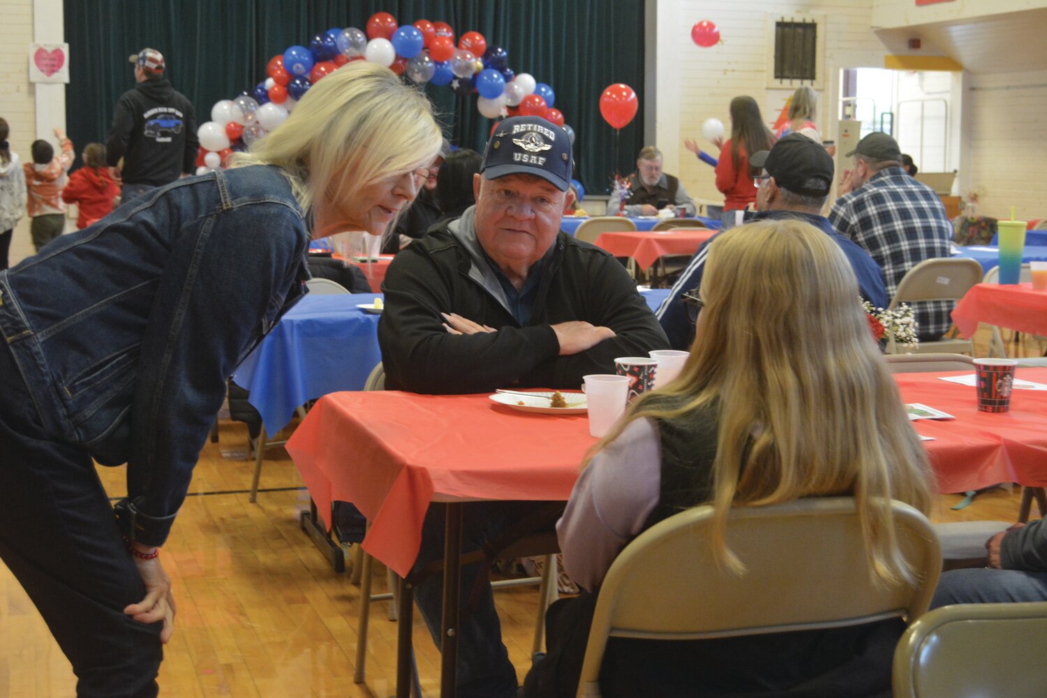A retired member of the United States Air Force enjoys breakfast at Roy Elementary School on Nov. 9.