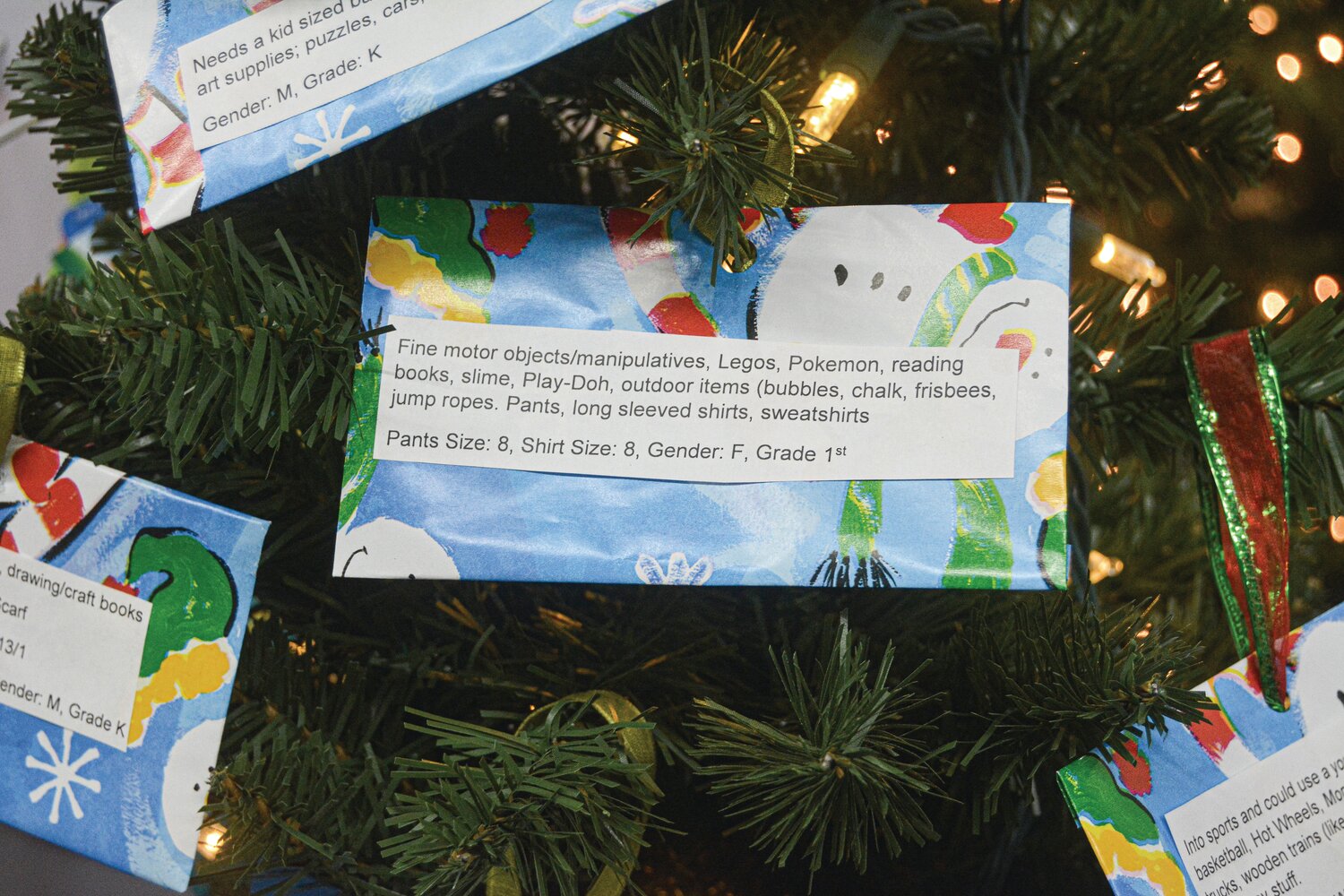 Students' requests on the giving tree at Funtime Toys and Gifts.