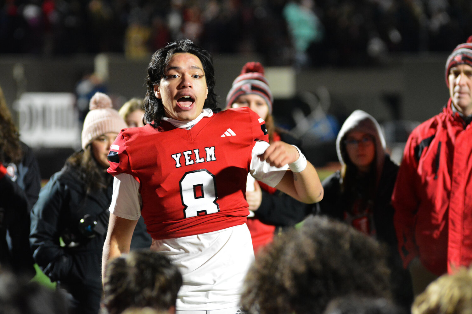 Senior quarterback Damian Aalona delivers a passionate speech to his teammates on Nov. 17 after Yelm defeated Mount Tahoma, 29-12, in the 3A state quarterfinals.