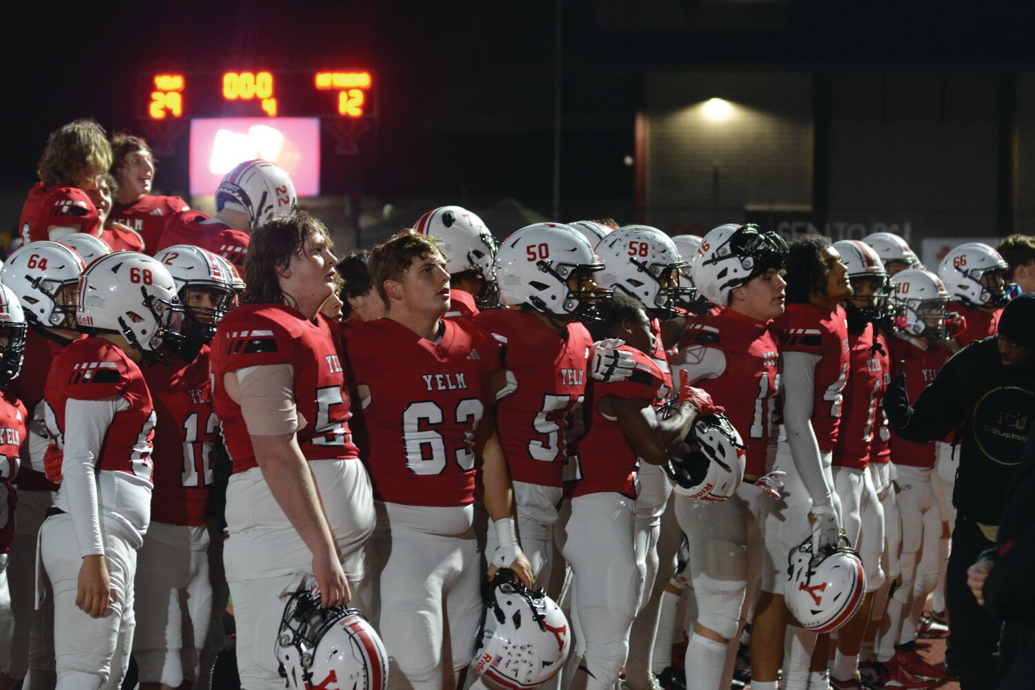 Yelm’s football team locks arms and sings John Denver’s “Take Me Home, Country Roads” after a 29-12 victory over Mount Tahoma in the 3A state quarterfinals on Nov. 17.
