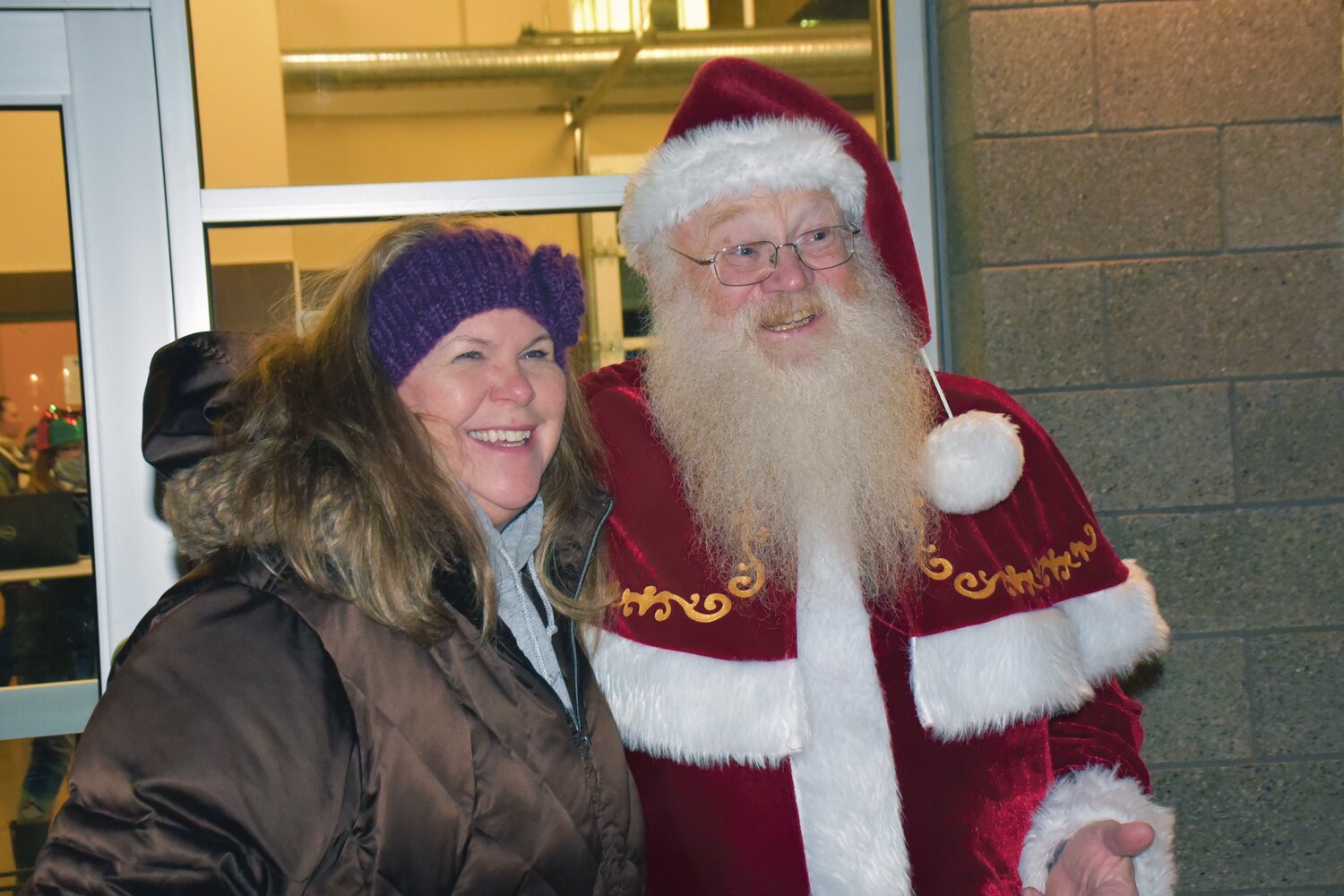 Harry Miller, as Santa, takes a photo with Holly Smith at a past Yelm Christmas tree lighting.