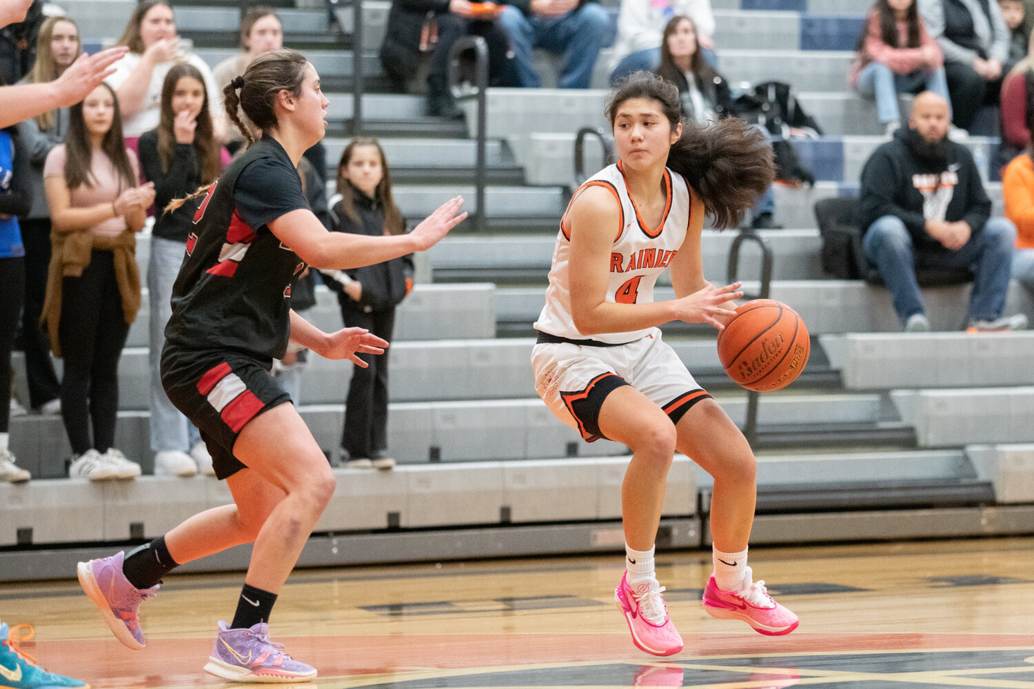 Angelica Askey looks for a pass into the paint during Rainier's 56-41 win over Neah Bay on Dec. 5.