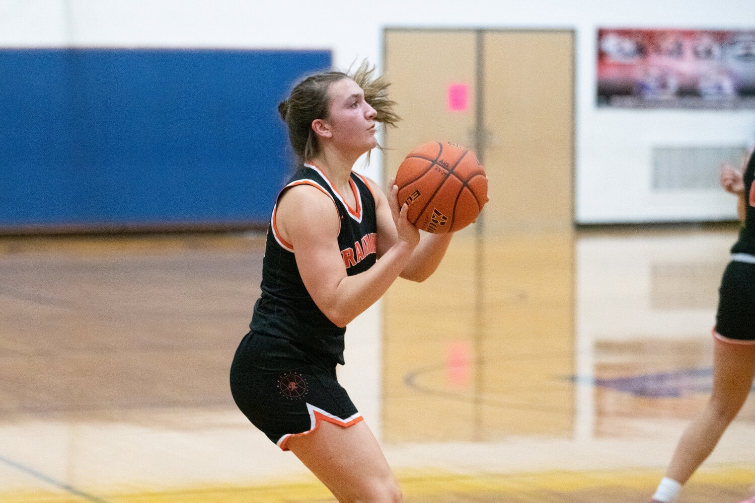 Bryn Beckman lines up a 3-pointer duiring the first half of Rainier's 52-49 win at Adna on Dec. 8.