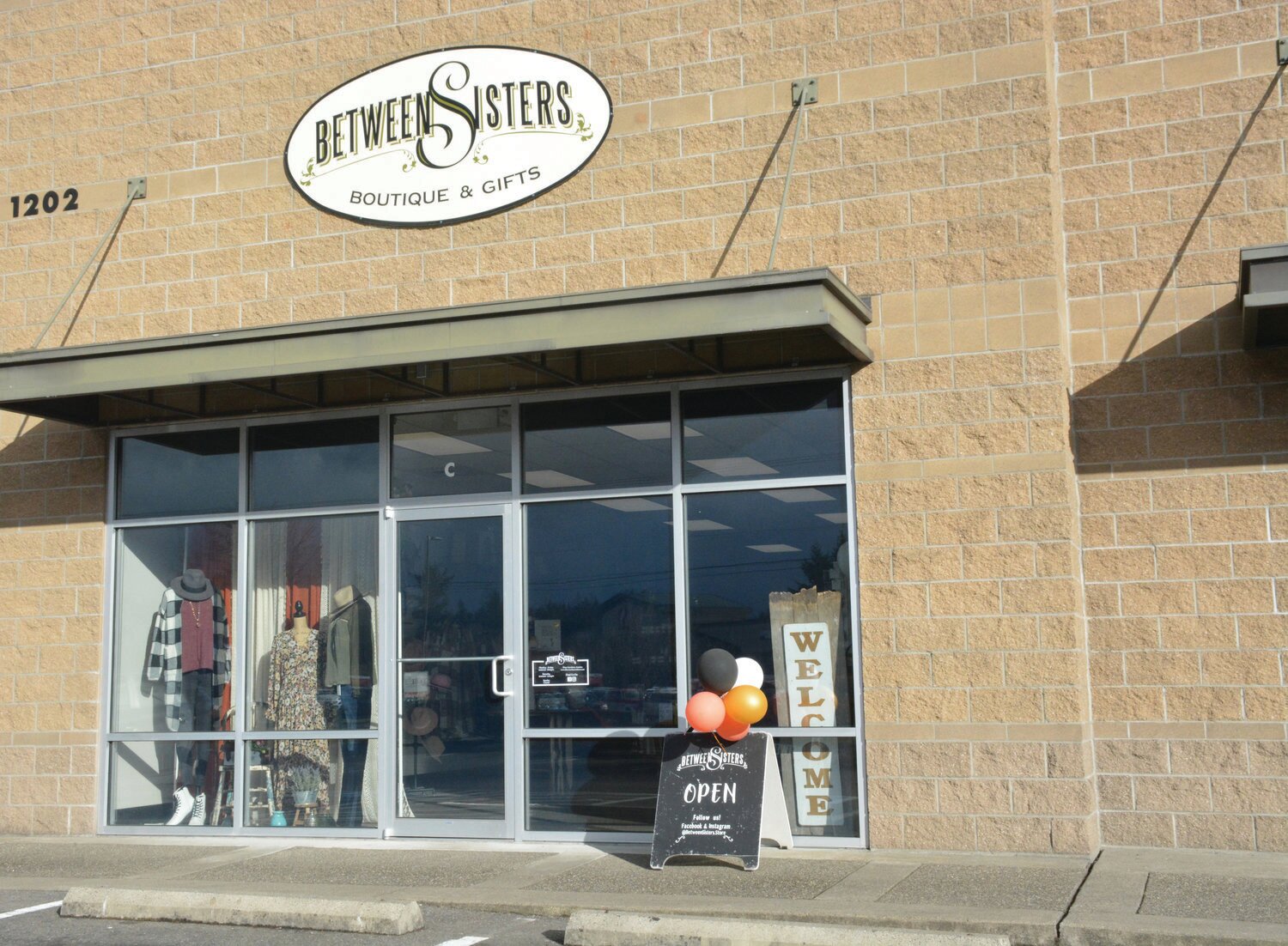 Between Sisters Boutique is located at 1202 E. Yelm Ave, Suite C, in the Dairy Queen plaza.