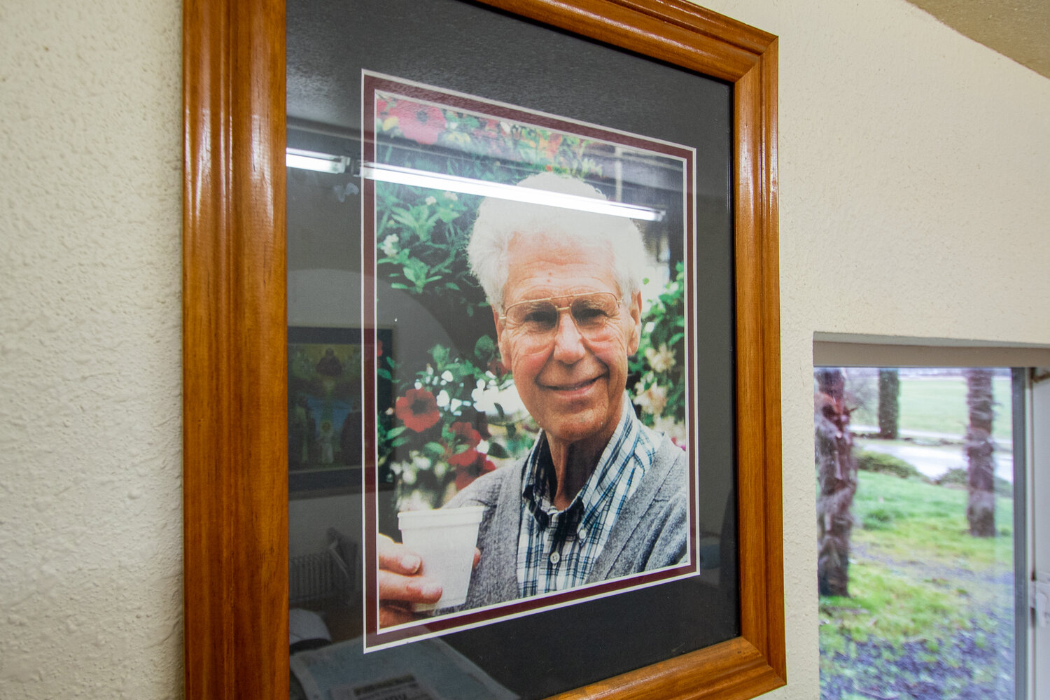 A photo of Hank DeGoede, founder of DeGoede Bulb Farm in Mossyrock, hangs on a wall in his sons’ office at the Our Lady of Guadalupe Chapel, on Tuesday, Jan. 30.