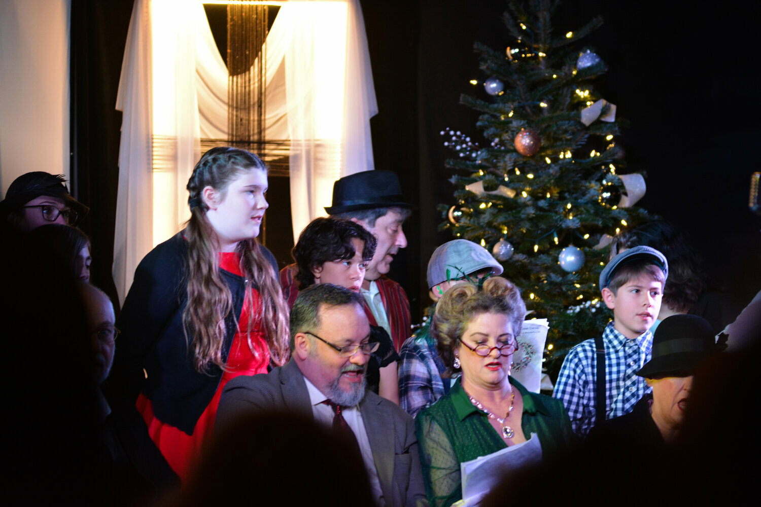 Members of the Standing Room Only Theater perform a Christmas song on Dec. 9 at Yelm’s Outpost Church during the group’s “It’s a Wonderful Life” performance.